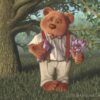 Standing in front of an old tree, a worried-looking bear clutches flowers and a box of candy. A digital painting by Stephen John Smith.