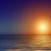 Bright sunset over tranquil sea