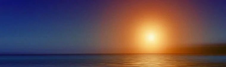 Bright sunset over tranquil sea