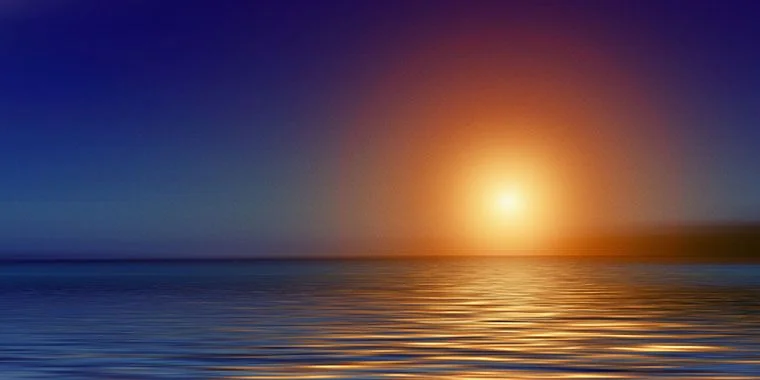 Bright sunset over tranquil sea